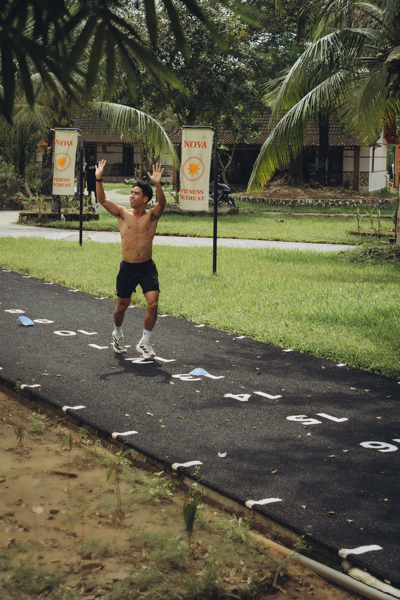 Founder finishing a run, arms raised