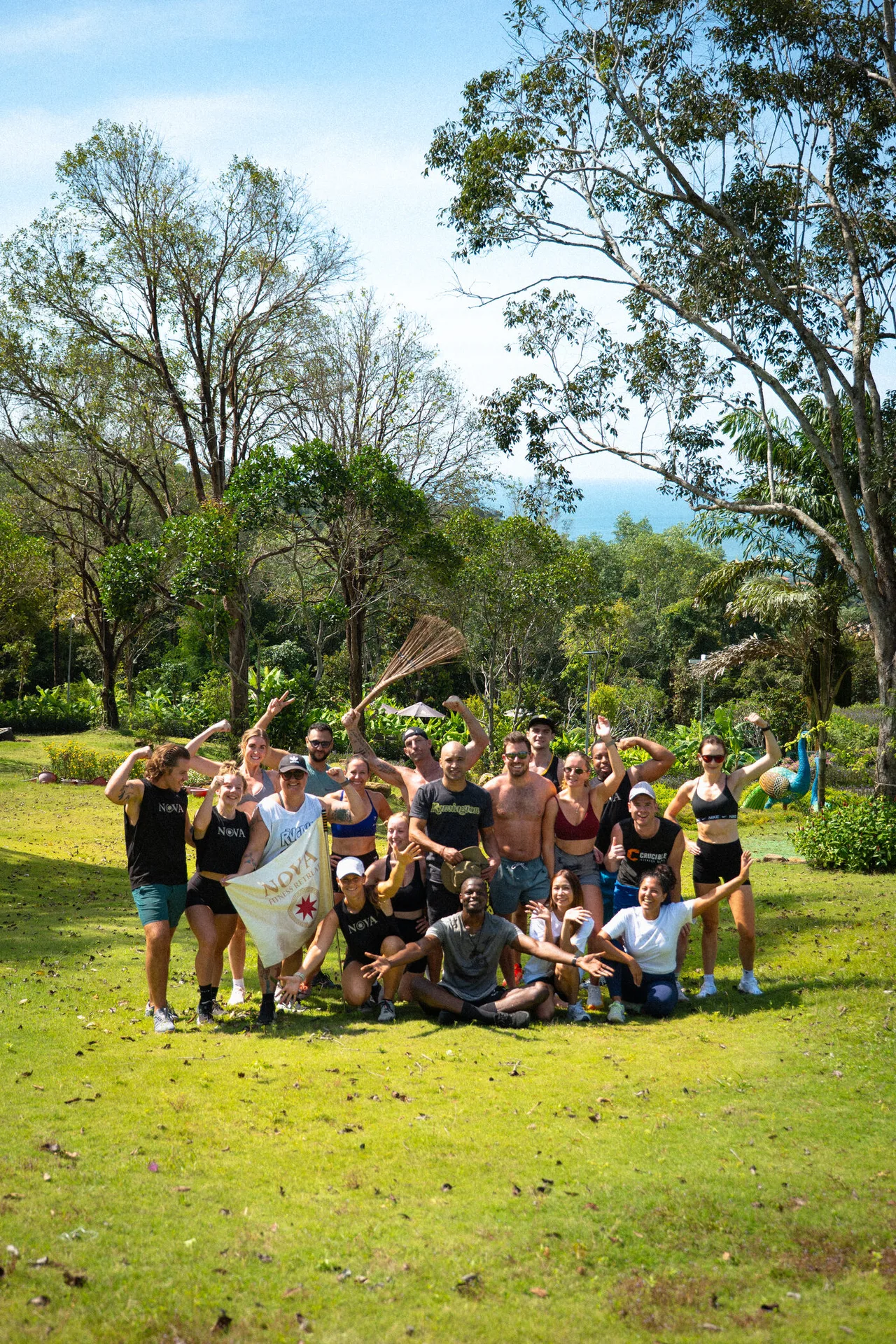 Founders posing as a group on a grassy hillside