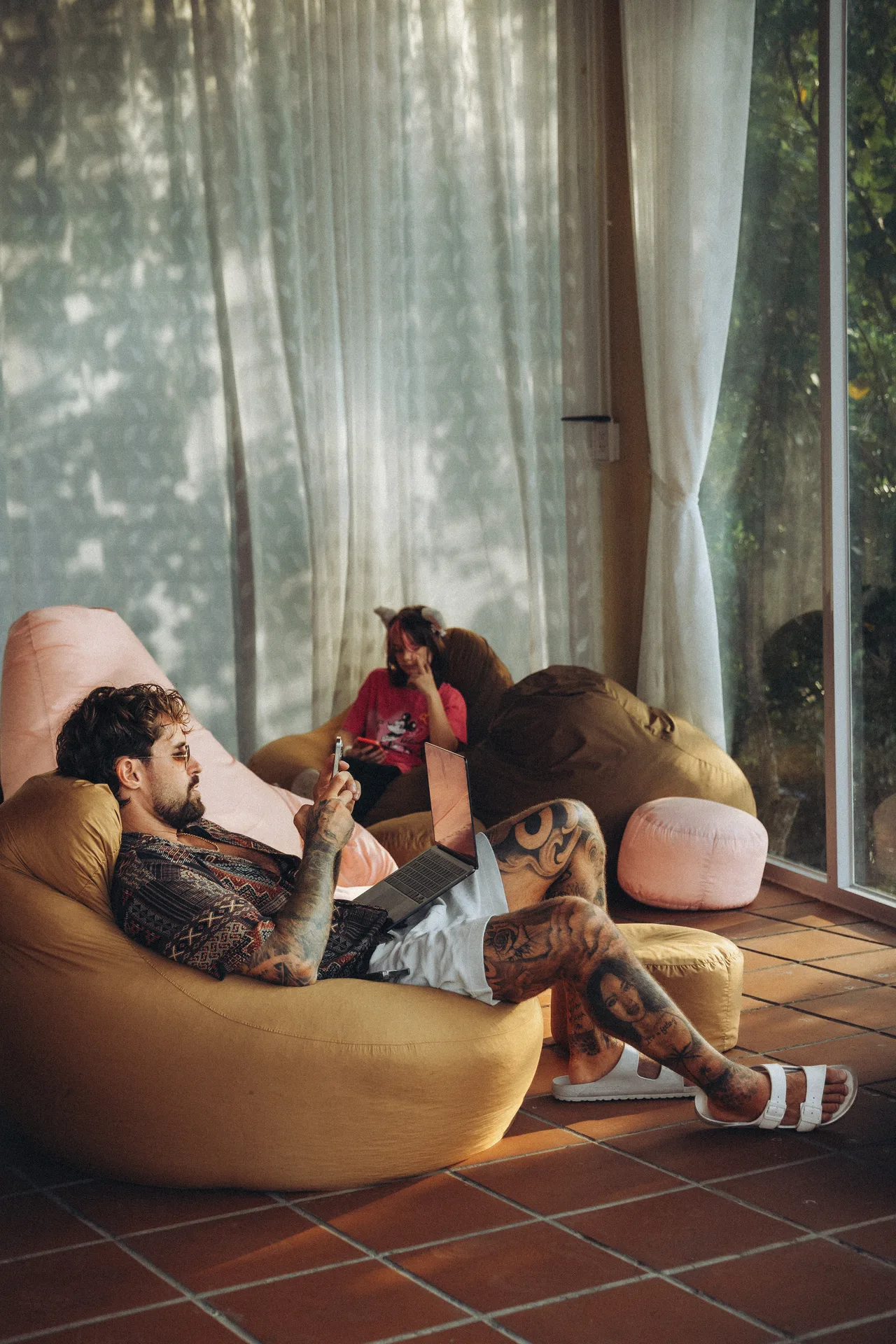 Bean bags, sunlight through curtains